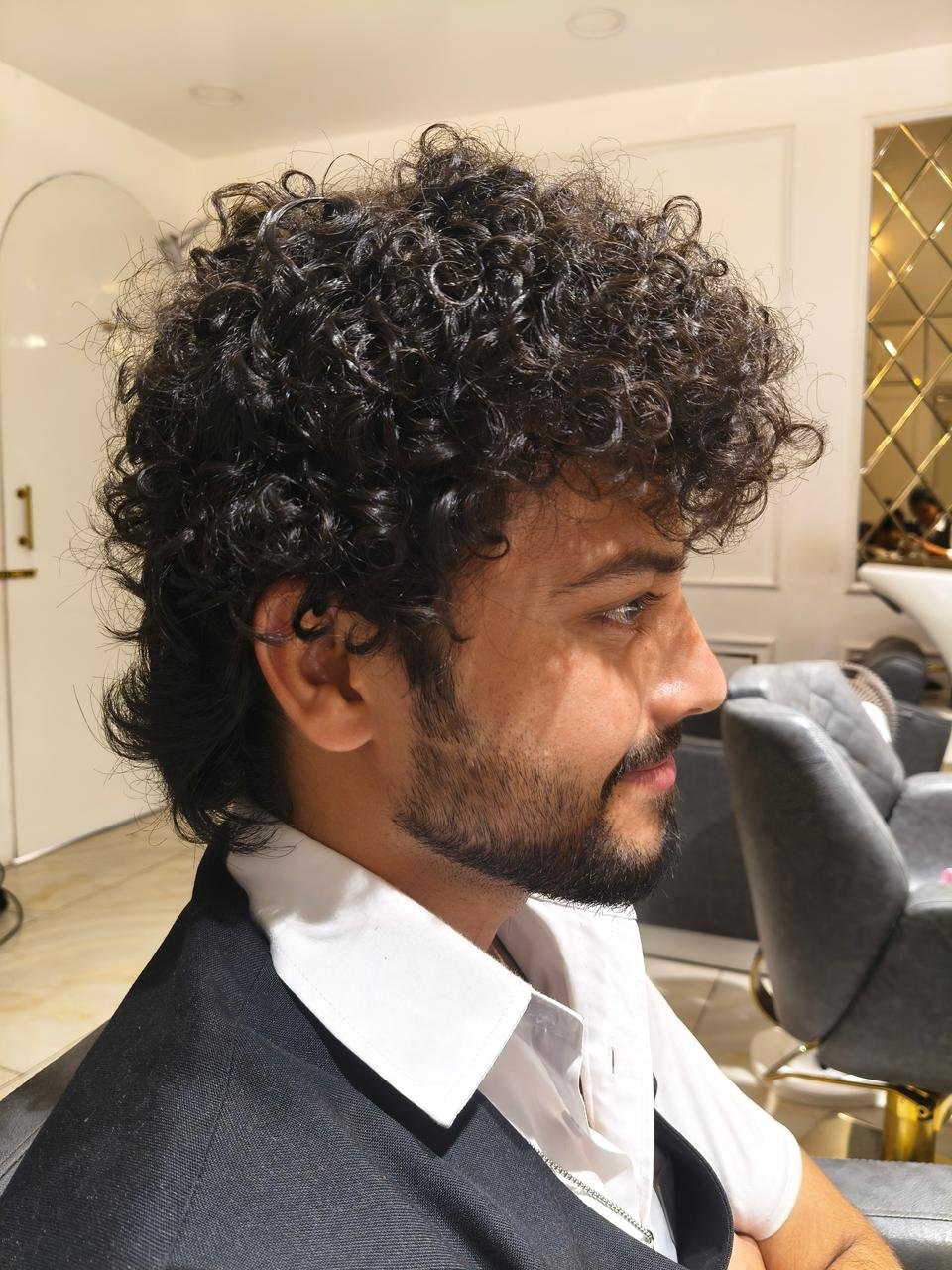 Beautiful model with long-lasting defined curls showcasing female hair perming treatment at Amedore Luxury Salon, Saheed Nagar Bhubaneswar