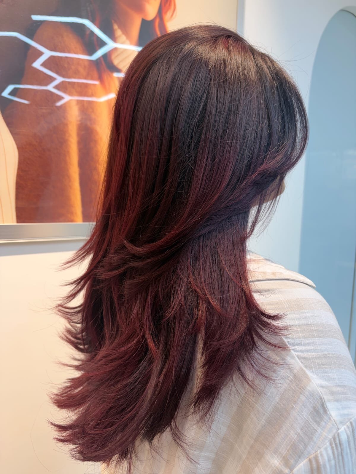Beautiful model with long-lasting defined curls showcasing female hair perming treatment at Amedore Luxury Salon, Saheed Nagar Bhubaneswar