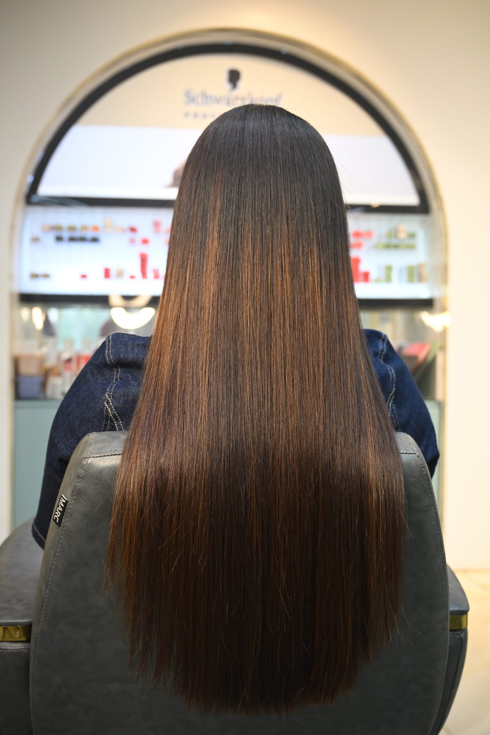 Beautiful model with long-lasting defined curls showcasing female hair perming treatment at Amedore Luxury Salon, Saheed Nagar Bhubaneswar