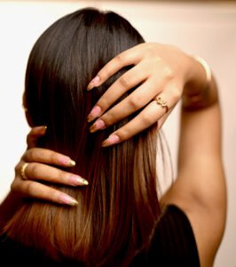 Beautiful model with long-lasting defined curls showcasing female hair perming treatment at Amedore Luxury Salon, Saheed Nagar Bhubaneswar