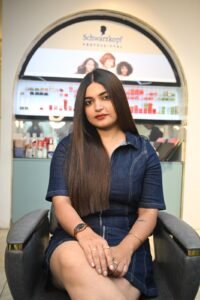 Beautiful model with long-lasting defined curls showcasing female hair perming treatment at Amedore Luxury Salon, Saheed Nagar Bhubaneswar