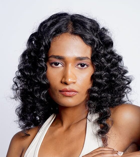 Beautiful model with long-lasting defined curls showcasing female hair perming treatment at Amedore Luxury Salon, Saheed Nagar Bhubaneswar